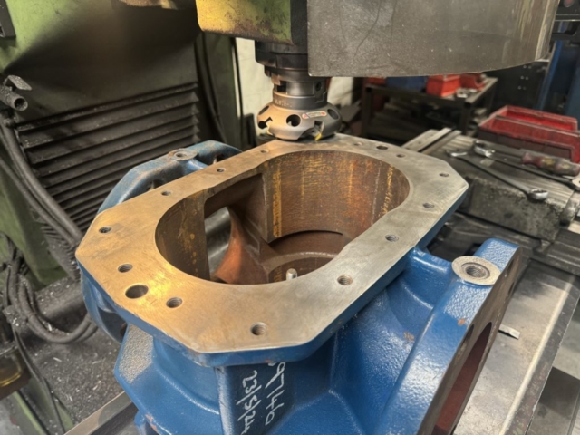 Face milling cast iron blower housing on milling machine